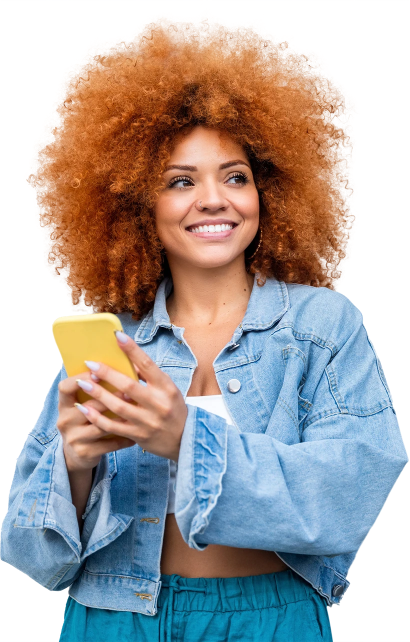 Smiling woman with curly hair holding a phone