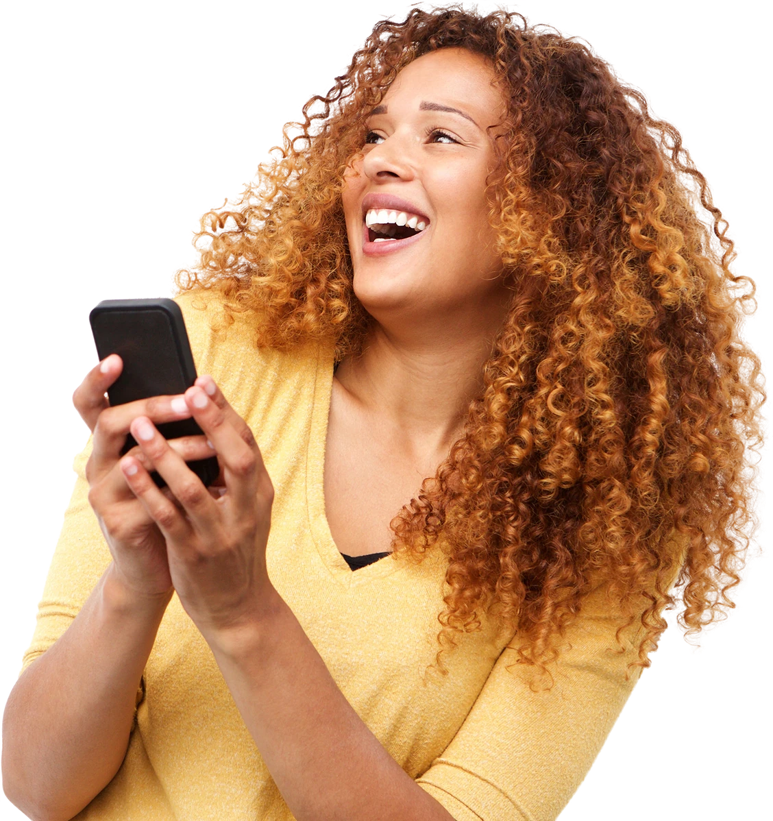 Laughing woman with curly hair holding a phone